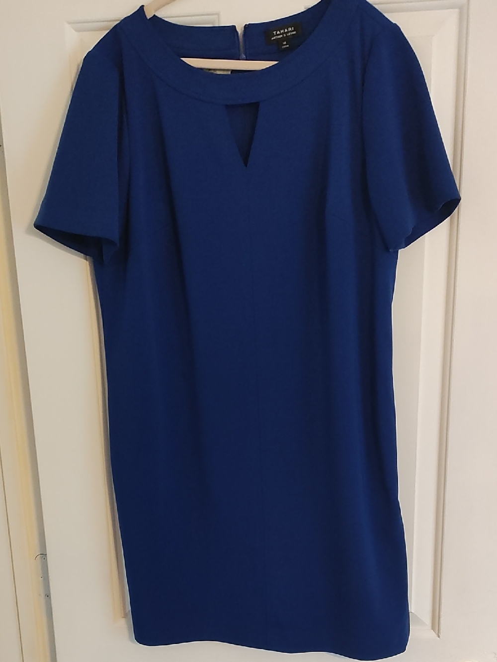 Tahari electric blue dress with a adjustable zipper on the right side